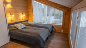 A bedroom on the second floor with a view of the lake